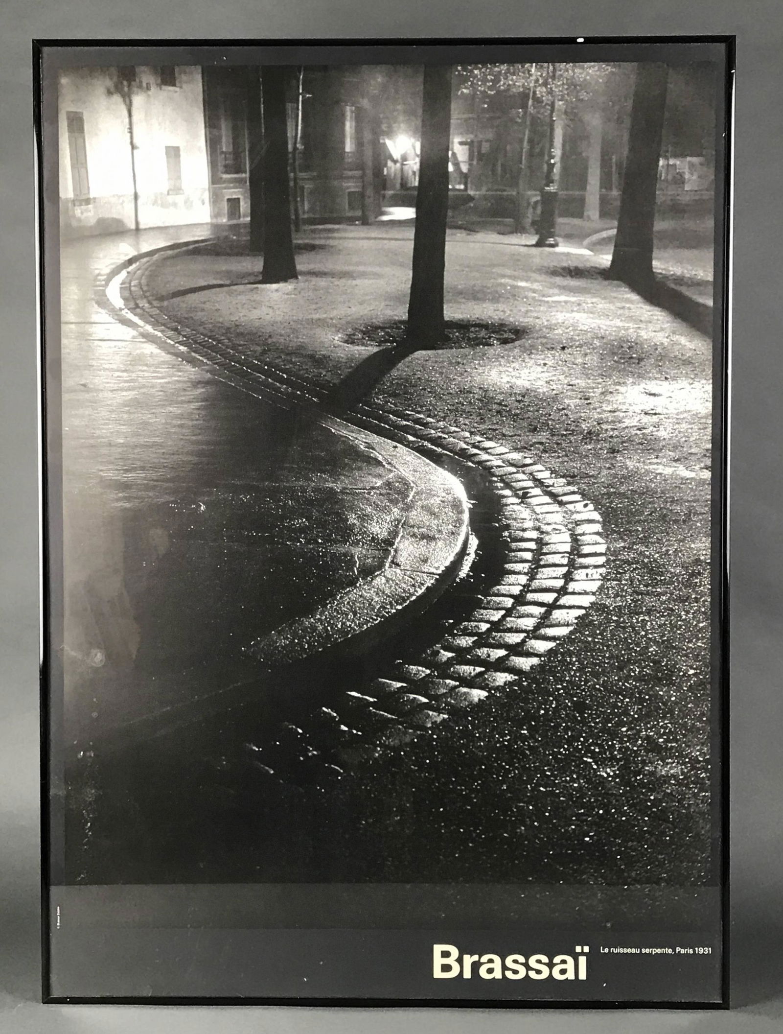 2 Brassai Posters.: After Brassai (Halasz, Gyula) (Hungarian-French 1899 - 1984). (1) Le Ruisseau Serpente, Paris 1931. Framed poster. Measures: 25 1/4" x 34". Published by Graphique de France. (2) Pont des Arts, 1934. P