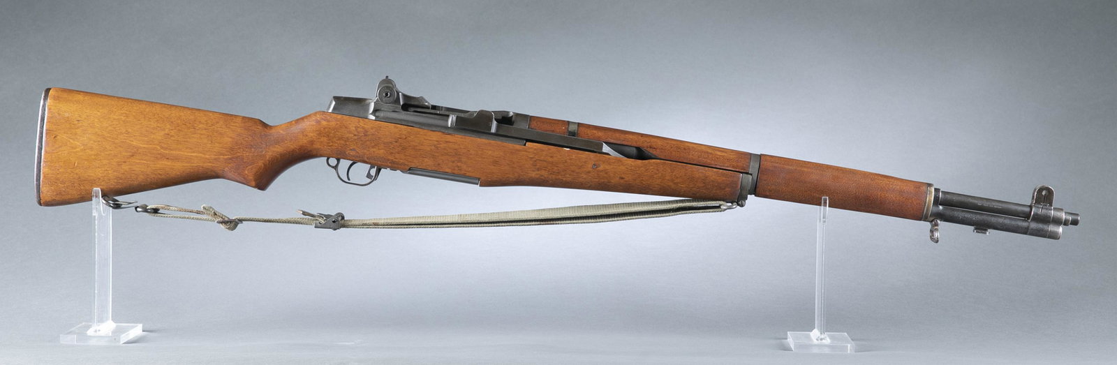 Rebuilt Springfield M1 Garand rifle, .30 cal.: Springfield M1 Garand semi automatic rifle, .30 cal. Parkerized finish. Rebuild. Arlington Ordinance Inc. import mark on SA marked barrel. Replaced stock. Pitted and refurbished front sight gas cylind