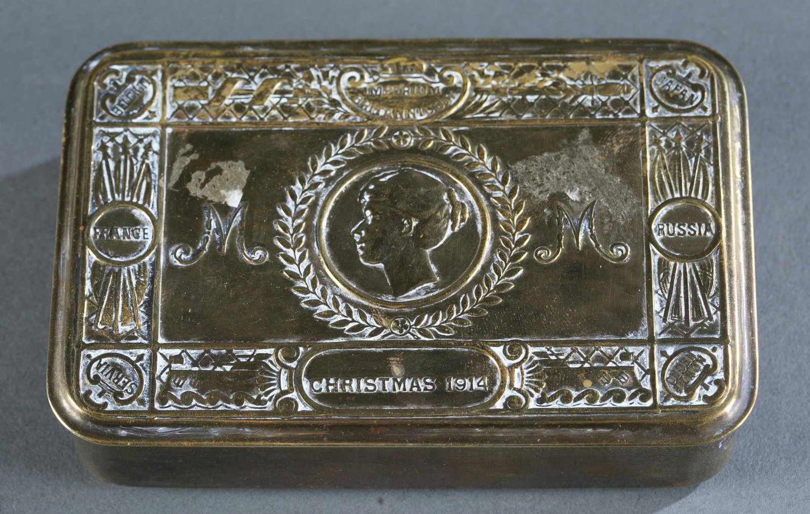 British WW1 Christmas 1914 Princess Mary tin.: British WW1 Christmas 1914 Princess Mary gift embossed brass tin.1 1/8" x 5" x 3 3/8" Provenance: Box was given to officers and men on active service. Contained a combination of pipe, lighter, 1 oz of