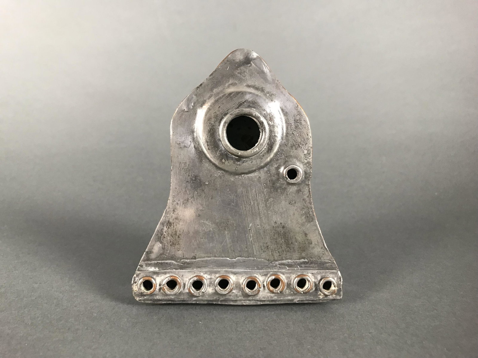 Hanukkah lamp: A rare tinned-copper antique travel form Hanukkah lamp, circa 1900. 4" x 3 3/8".