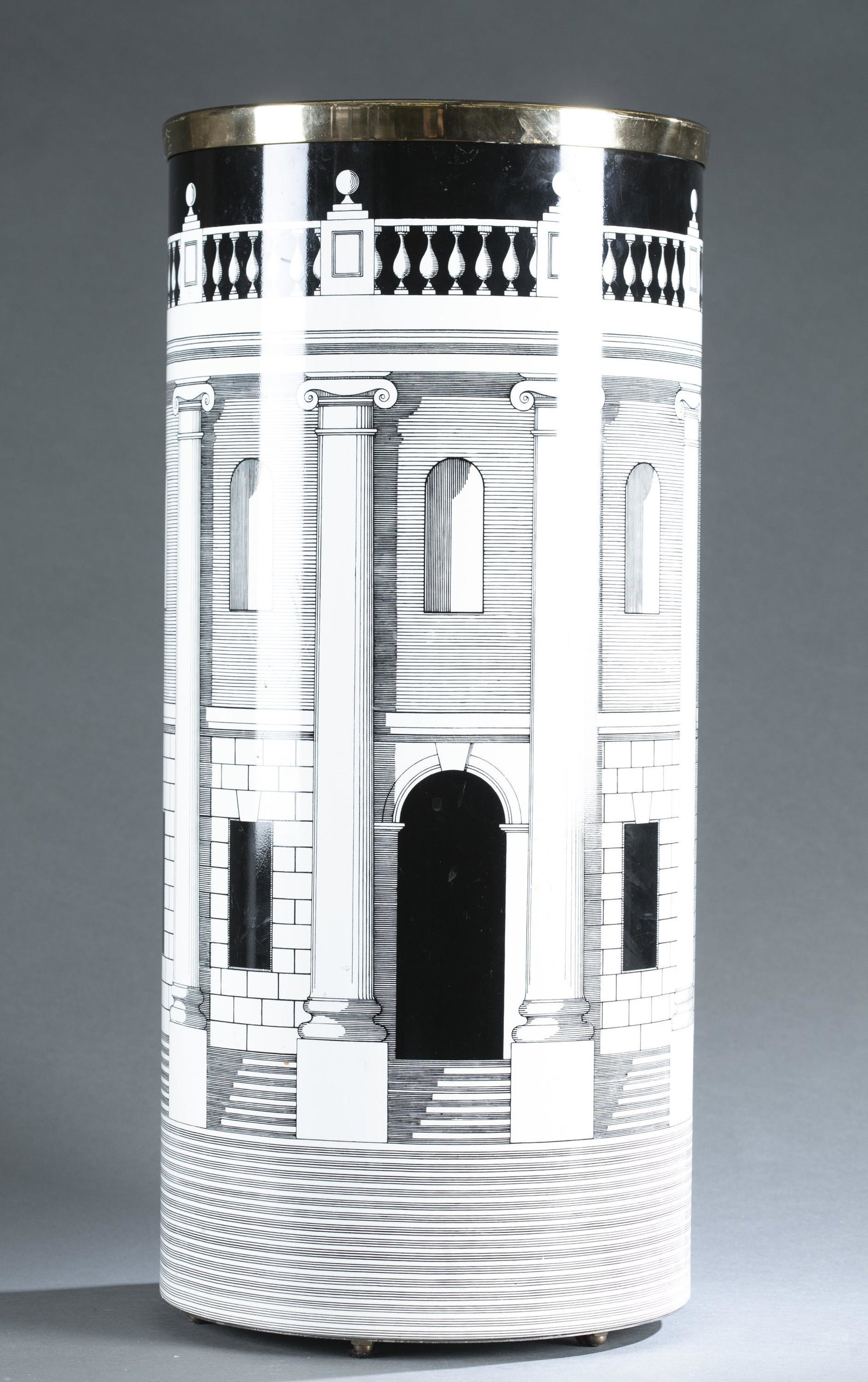 Fornasetti, "Casa con Colonne," umbrella stand.: A Piero Fornasetti "Casa con Colonne" umbrella stand. Marked "FORNASETTI MILANO MADE IN ITALY Nr. 2/93." 22 3/4" x 10 1/4"Condition: Marks on outside of stand. Residue on side near bottom.