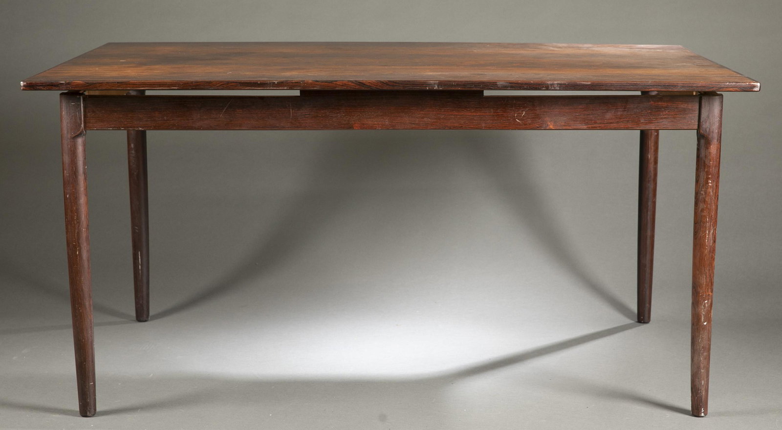 Danish Modern Randers rosewood table.: A Danish Modern Randers Mobelfabrik rosewood table. Two internal draw leaves. 29" x 58 1/2" x 36 1/2"Condition: Leaves separated.Provenance: From The Estate of Marvin Oleshansky.