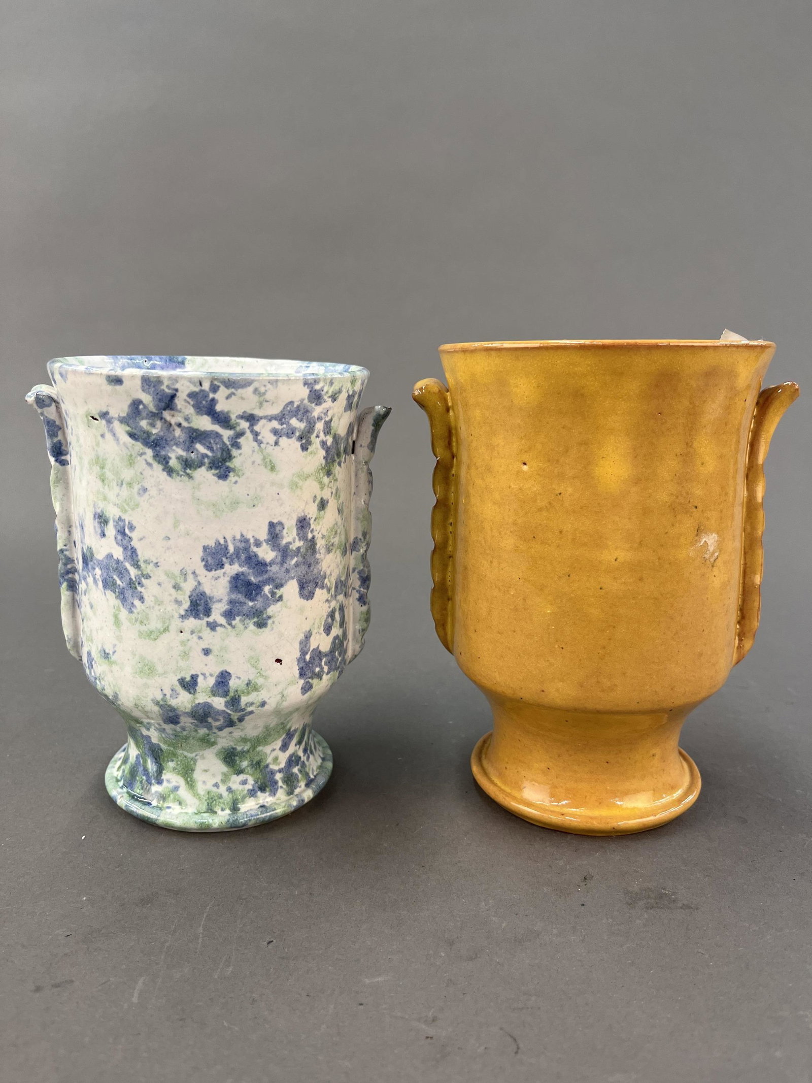 2 North Carolina redware vases.: A pair of Neolia Cole (North Carolina, 1927-2016) redware vases. Signed and dated on base. 12 1/2" x 10".Provenance: From The Estate of Marvin Oleshansky.