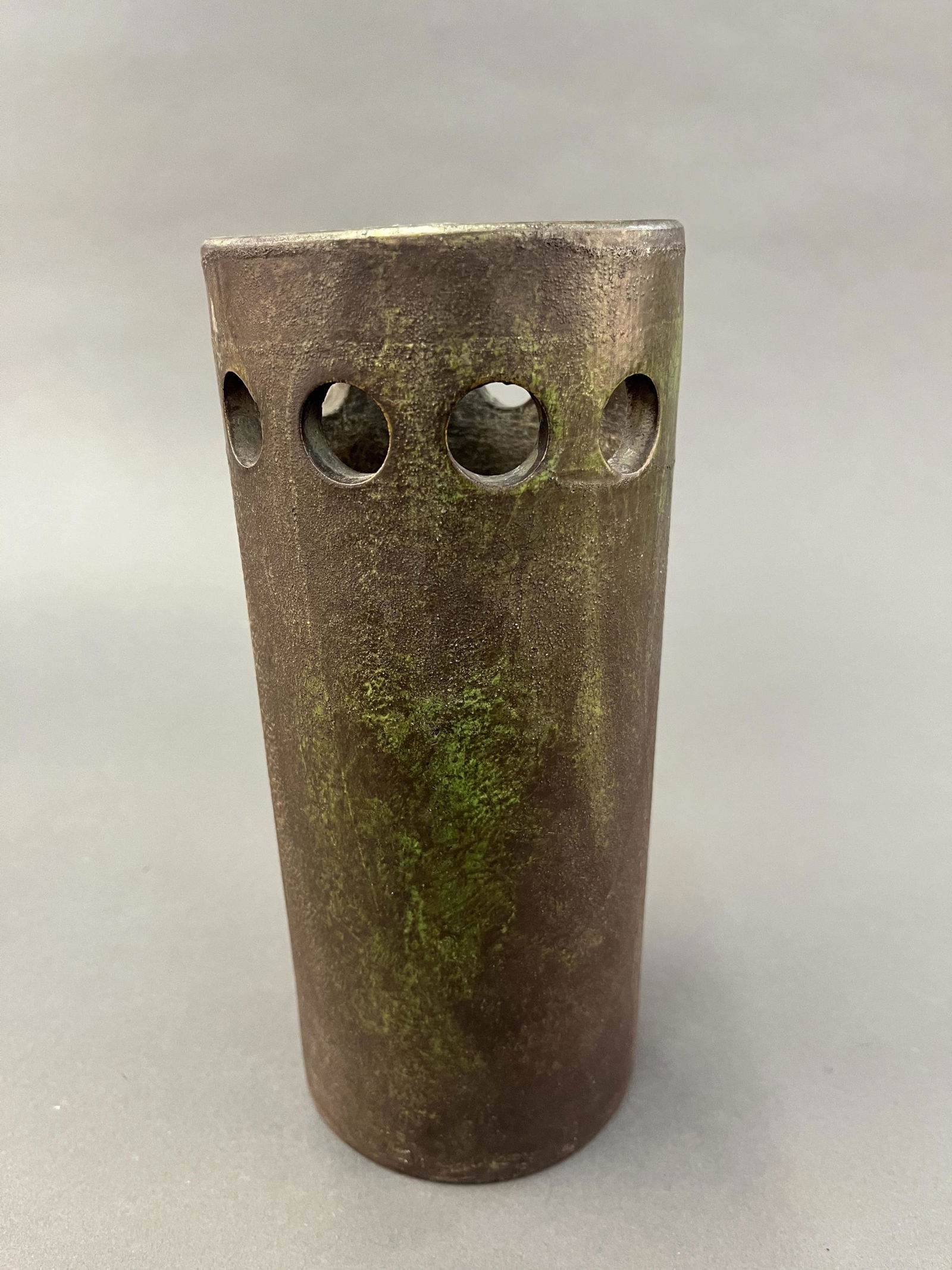 Bitossi "Etruscan" pierced vase.: A Bitossi, Italy "Etruscan" pierced vase. Signed on base "45/52 ITALY." 9" x 4".Provenance: From The Estate of Marvin Oleshansky.