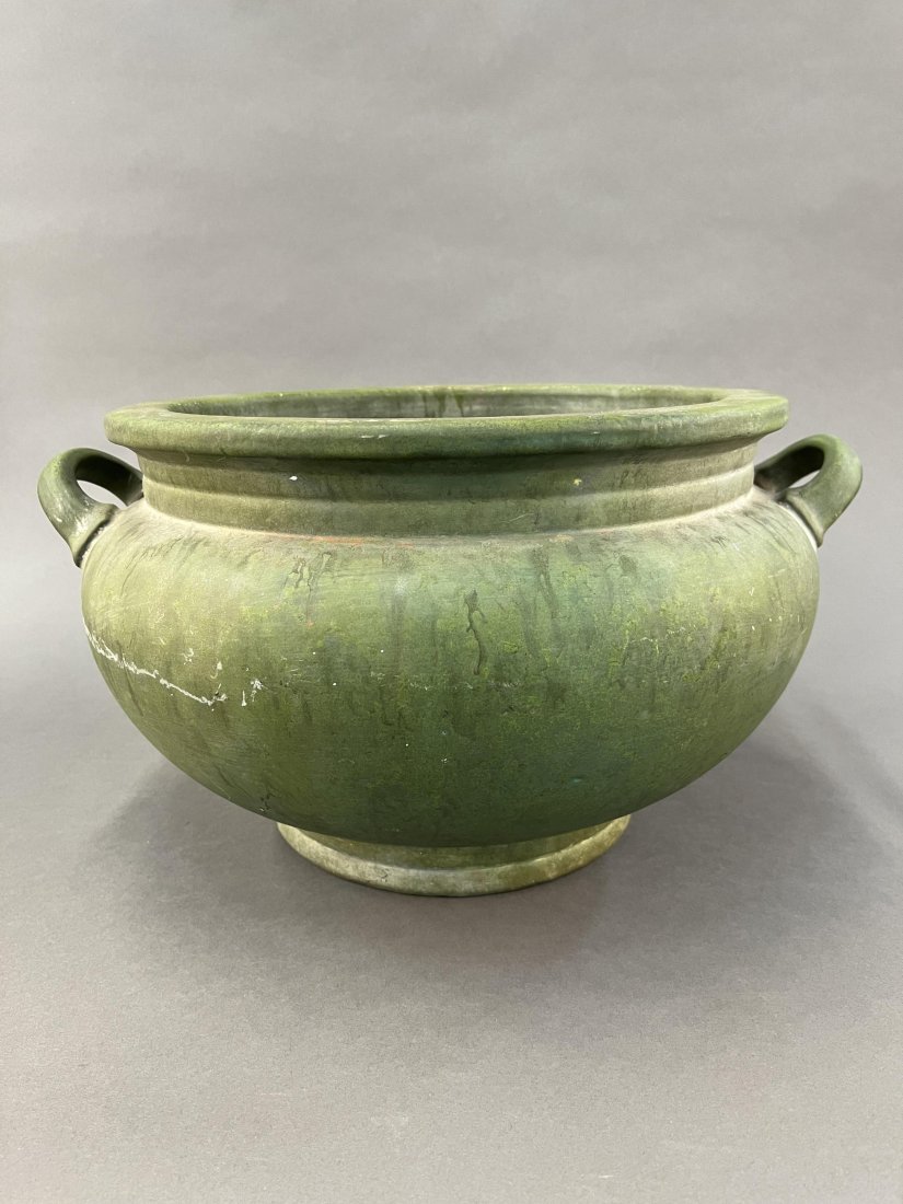 Roseville Pottery early "Carnelian" jardiniere.: A Roseville Pottery early Carnelian matte green two handle jardiniere. Roseville, OH. Circa 1920s. Unmarked. 9" x 16 1/2".Provenance: From The Estate of Marvin Oleshansky.