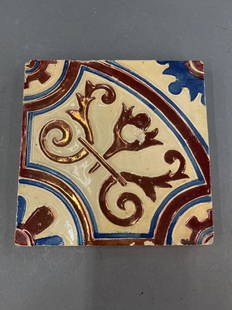 American Art ceramic tiles.: A group of American Art square ceramic tiles with copper and azure scrolling decorations. 6 1/4" x 6 1/4".Provenance: From Sylvia and Dr. William Regelson, Ouroboros at Antique Village.