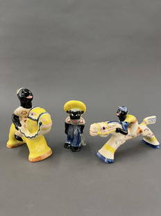 3 Shearwater Black Americana figures.: A group of three Shearwater Pottery Black Americana figures. 20th century. Camel rider and man marked "SP 97." Smallest: 5 1/2" x 3 1/4" x 2 1/2". Largest: 6 1/2" x 7 1/4" x 2 1/2".Provenance: From Th