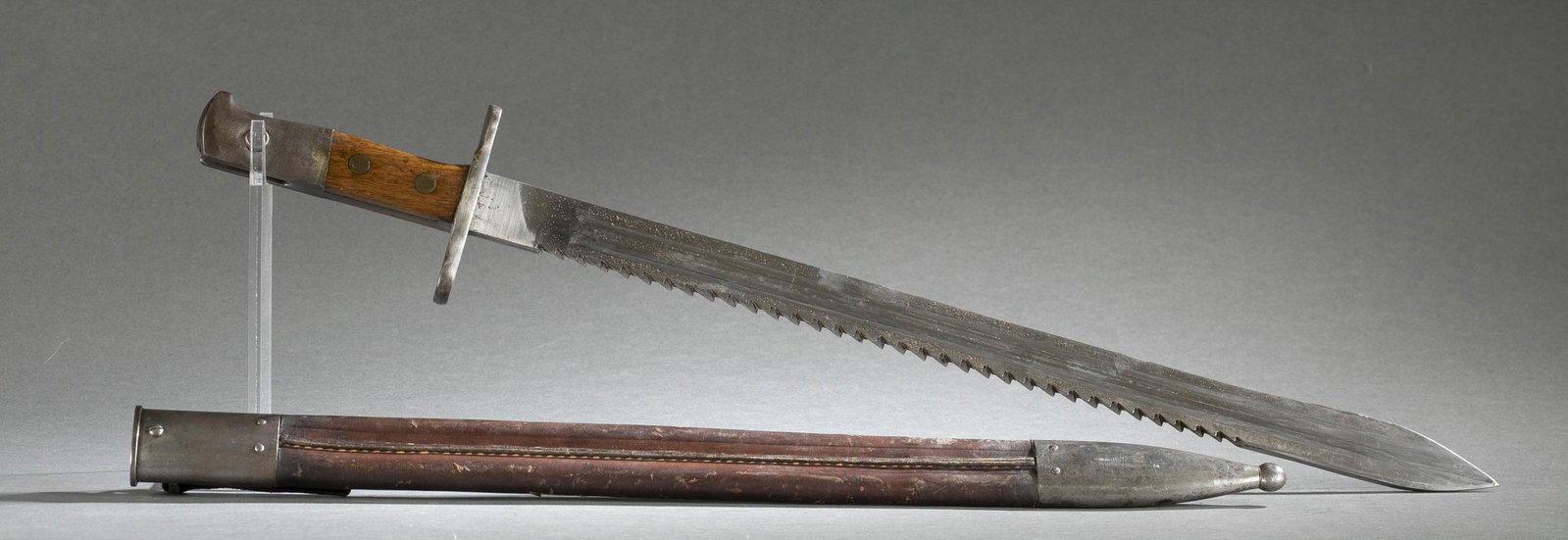 Swiss M1914 sawback bayonet and scabbard.: A Hans Steimer Swiss Model 1914 sawback sword bayonet with scabbard. Ricasso marked "HS." Serial 38626. Early production leather scabbard. Blade: 19 1/2" Overall: 24" Scabbard: 19 7/8"