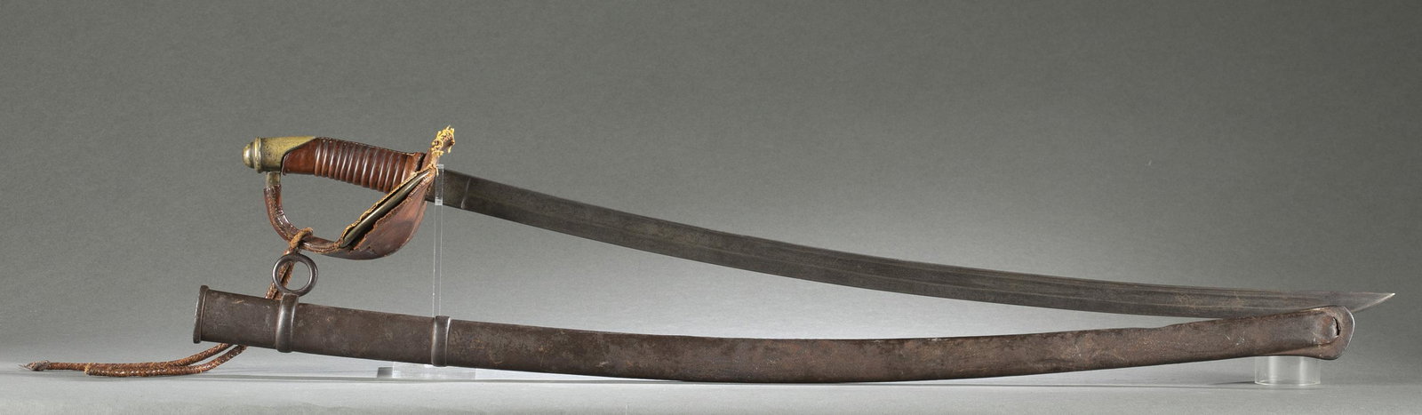 Mexican Republic M1822 cavalry saber.: A Mexican Republic Army Model 1822 cavalry saber with scabbard, Circa 1835-1846. Ricasso marked with Republic's Liberty cap surrounded by light rays over "RM." Reverse marked "A.C./ Mexico." Brass gua