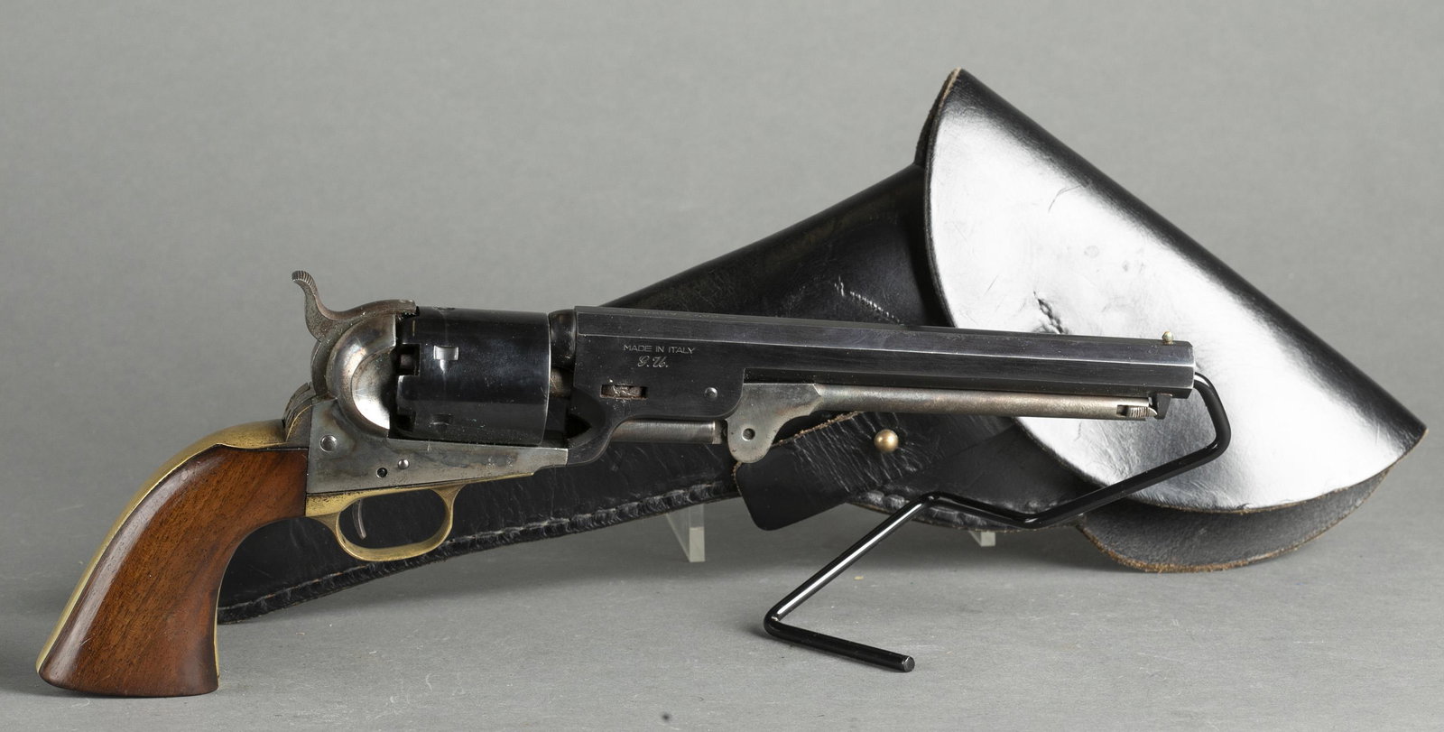 Navy Arms Uberti 1851 Navy revolver, .38 cal.: [Antique Firearm] A Navy Arms Uberti 1851 Navy percussion black powder revolver, .38 cal. Blued and case finish with brass grip frame. 7 1/2" octagonal barrel. Includes leather holster.Condition: Good