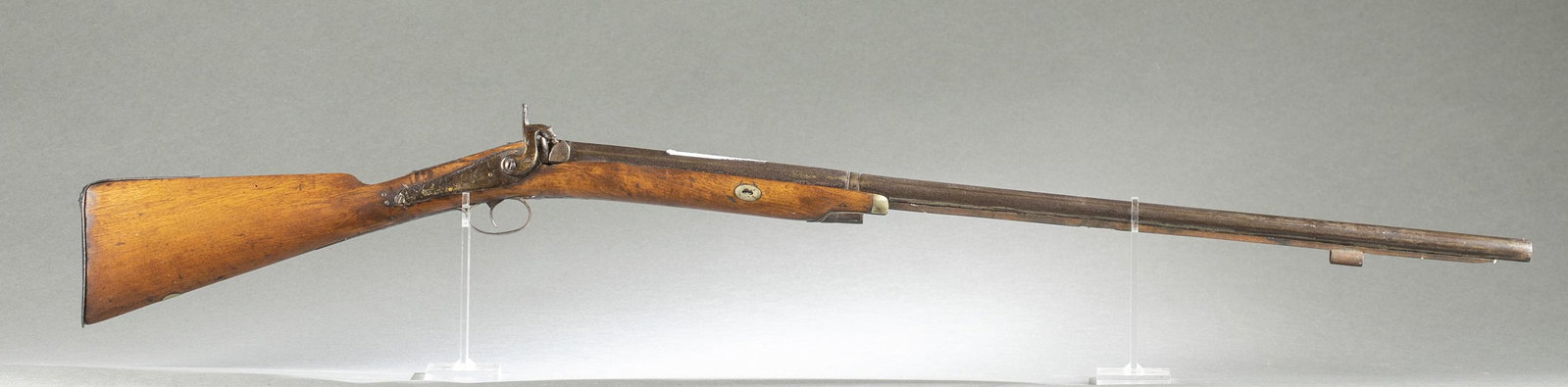 Belgian percussion fowler.: [Antique Firearm] A Belgian percussion half stock fowler. 33" octagonal and round barrel. Proof marks on barrel. 50" overall.Condition: Fair condition. No original finish. Oxidation on metal. Crack in