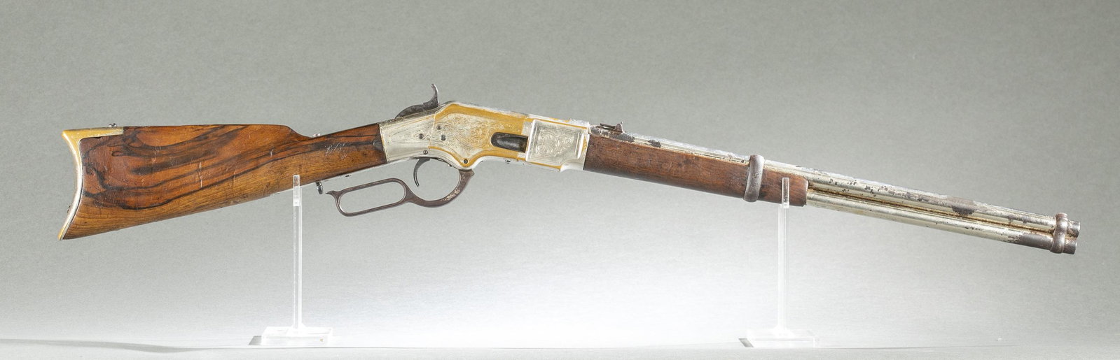 Winchester M1866 3rd Model carbine, .44 Rimfire: [Antique Firearm] A scarce Winchester Model 1866 Third Model lever action rifle, .44 Rimfire. Manufactured in 1869. Nickel plate finish. Engraved nickel on brass receiver. Serial on tang 23958. 20" ro