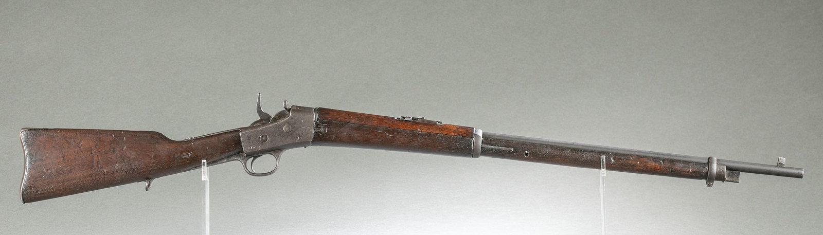 Remington Rolling Block rifle 7mm SM: [Modern Firearm] A Remington Rolling Block military rifle, 7mm Spanish Mauser. Illegible marking on left side of receiver. Serial 1013. 30" barrel with caliber marking. 45 1/2" overall.Condition: Fair