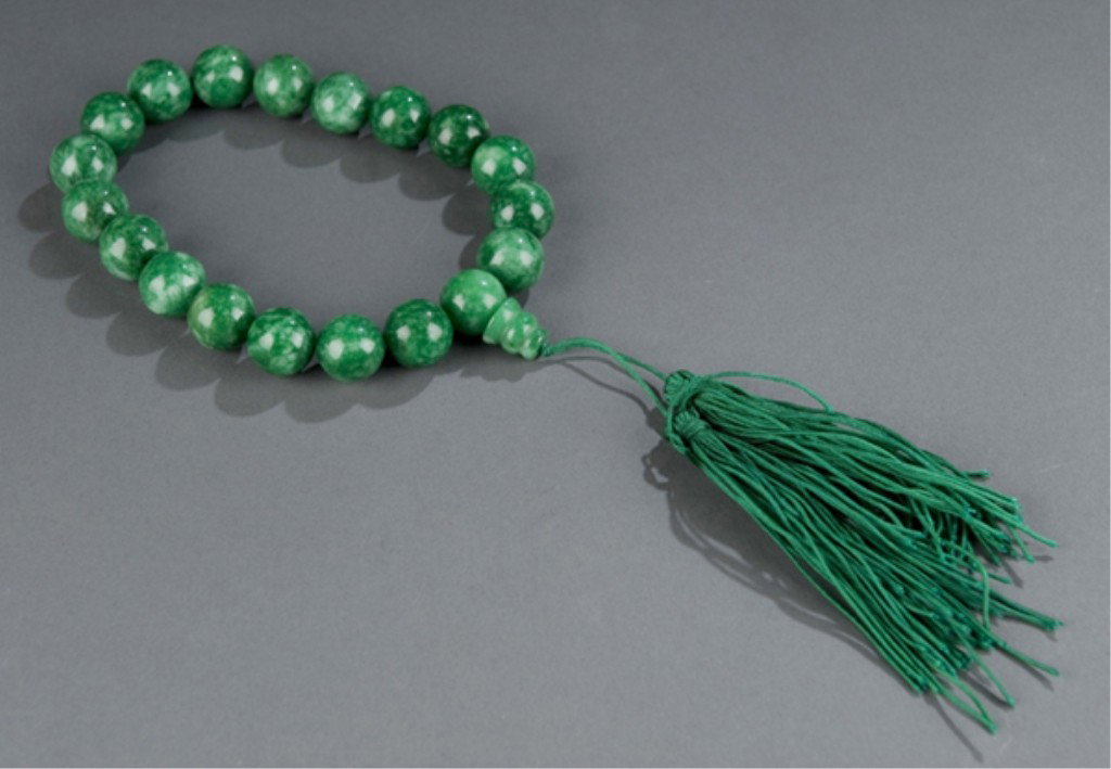 Chinese Buddhist apple green jade prayer beads.: Chinese Buddhist apple green jade prayer beads. 20th century. 19 beads total with finial and green tassel from one. Bead: 5/8"diam.
