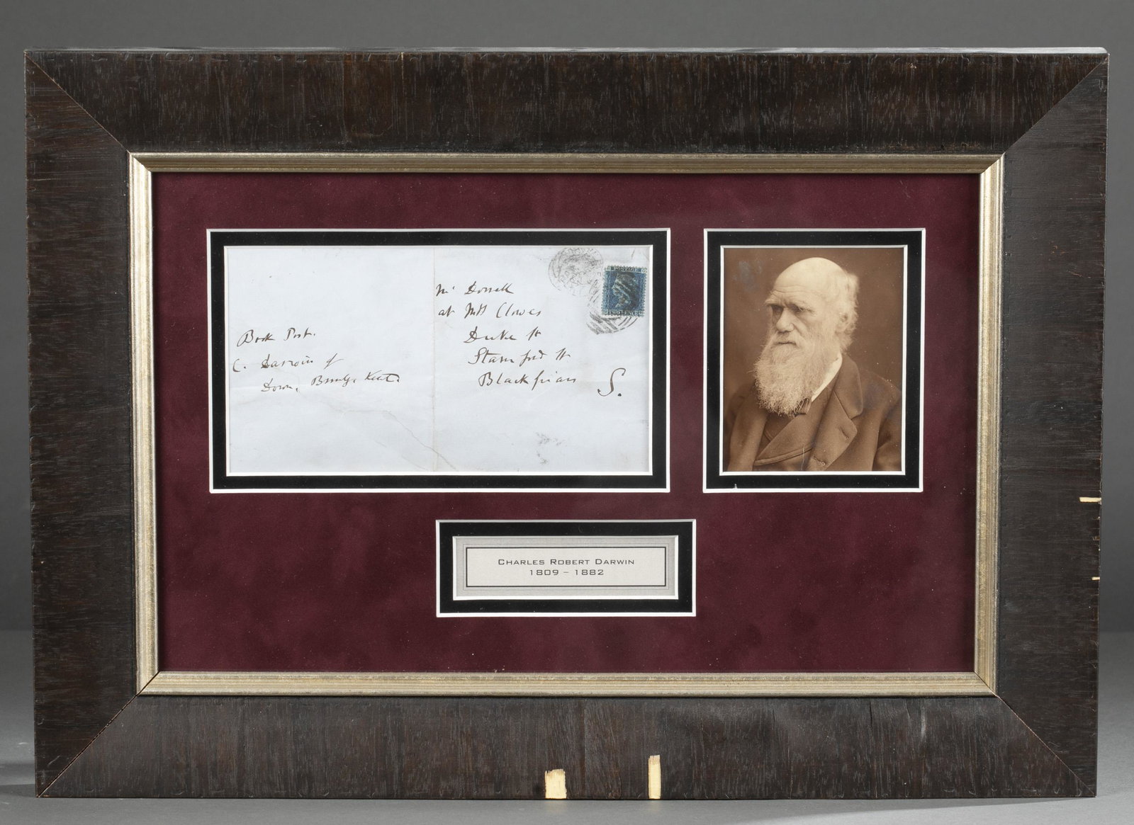 Charles Darwin Handwritten Envelope: [Autograph] Charles Darwin written envelope, stamped with a Two Blue Penny, and written between 1849-1858 at his residence, Down House, in Kent, England. The envelope is double matted with a sepia ton