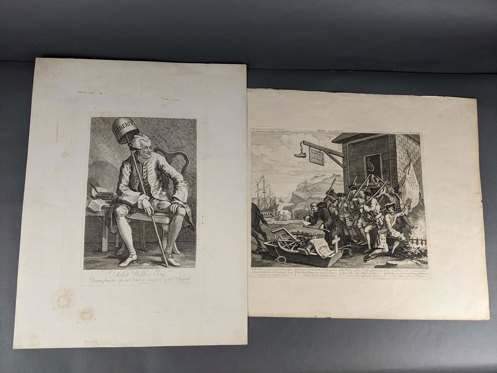 2 Hogarth Engravings: [Engravings] Hogarth, William. Two engravings John Wilkes Esq.(18" x 23 1/2") and France Place (25" x 17) dated March 8, 1756. Copperplate engravings.Condition: Toning and staining, some chipping on e