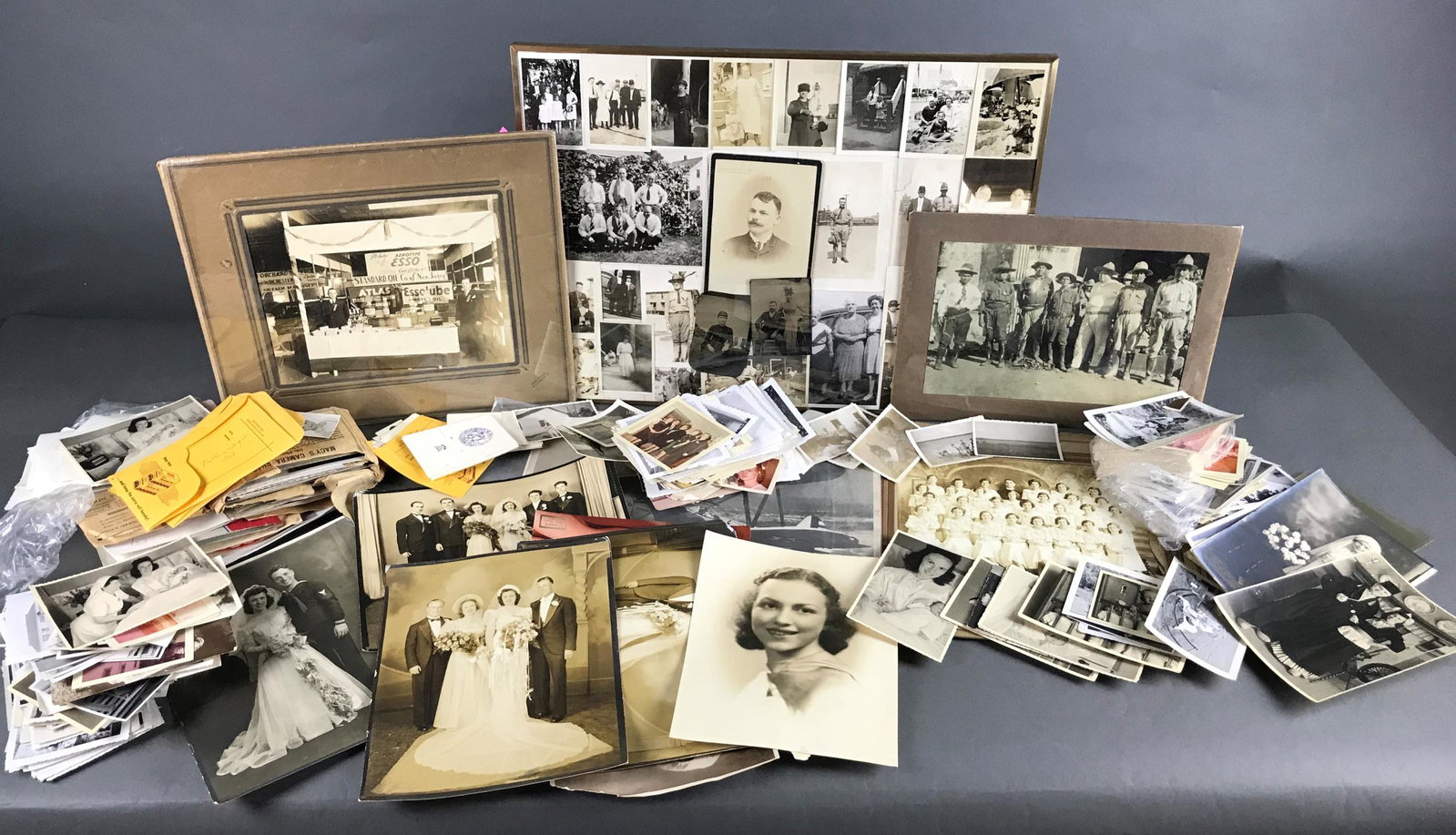 1940s-1950s Era Ephemera and Photographs: [ephemera] 100+ Photographs and other pieces of ephemera mostly from WWII era and after. Some antique photos. Includes photos, albumen photographs, tin types, photo post cards, and more.Provenance: Fr
