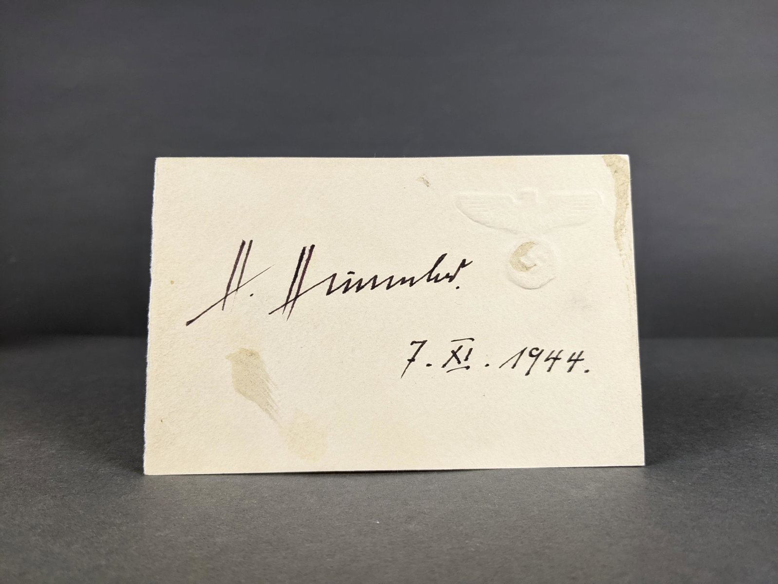 Himmler Signed Card.: [WWII] Himmler, Heinrich (1900-1945) Signed card on German Party stock with blindstamp symbol in u.r. Signed in black ink and dated 7.XI.1944. Signed during the midst of the July assassination plots. 