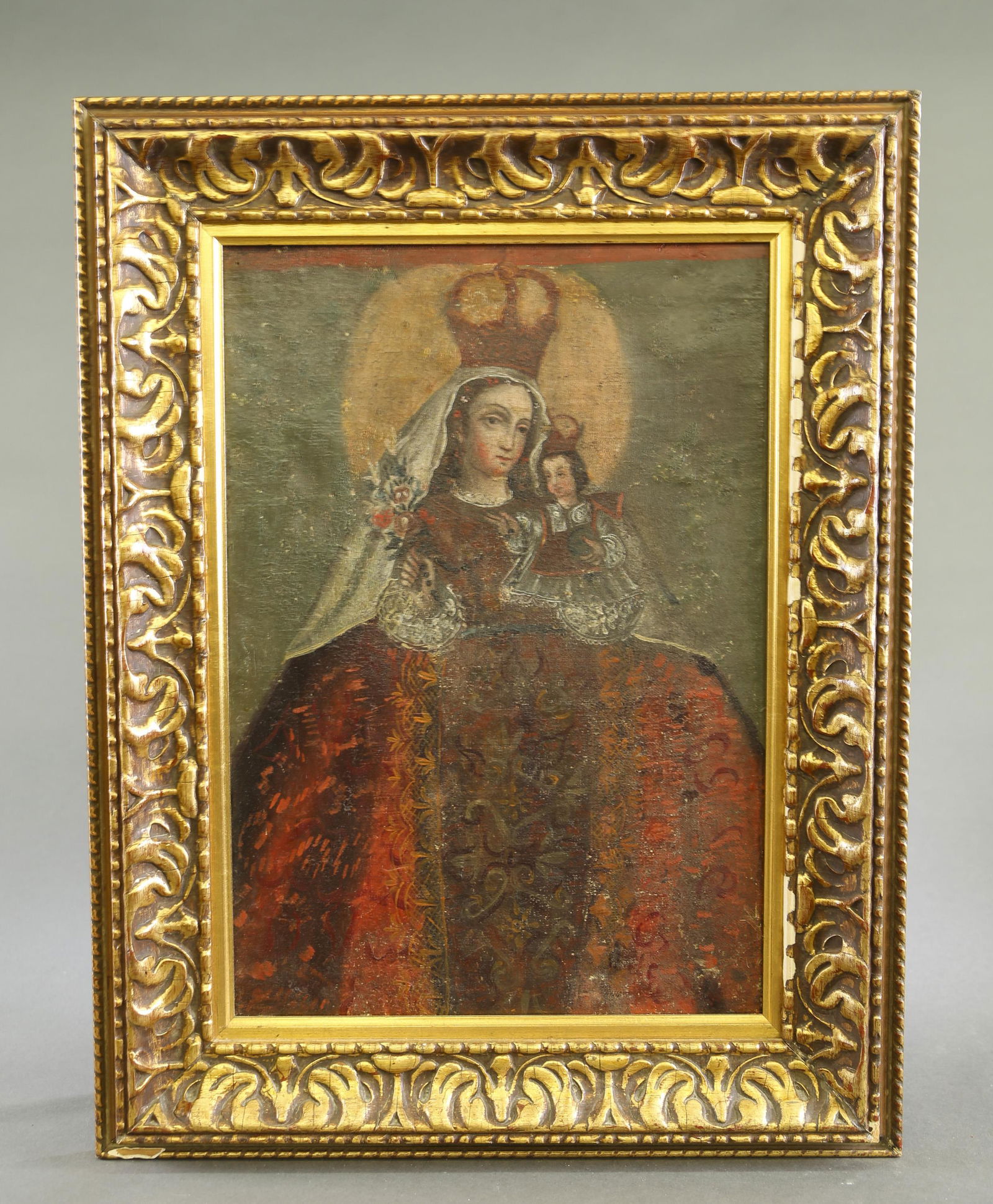 Cuzco style Madonna and Child, O/C.: A Cuzco Spanish Imperial style Madonna and Child. Oil on canvas. 19th century. Sight: 19 1/2" x 13 1/2". Frame: 26 1/2" x 20 1/2".Condition: Craquelure, chipping to paint, inpainting evident under bla