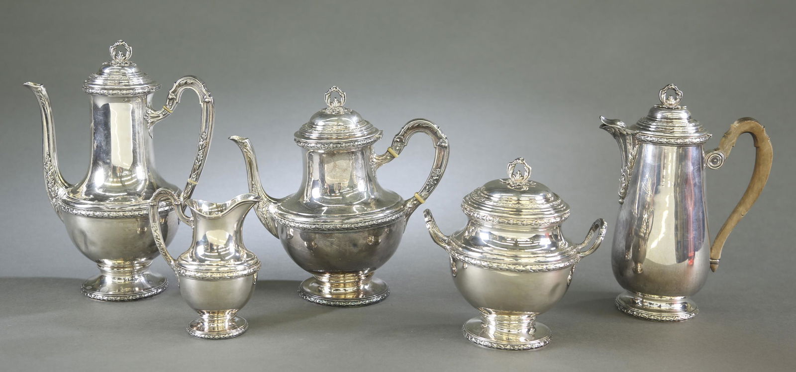 French five piece silver tea service.: A V. Boivin, Paris five piece silver tea service. Circa 1900. Marked on bottom with "VB" makers mark and marked with .950 silver standard Minerva head mark. Coffee pot. 11" x 8" x 5 3/4". 23.78 ozt. C