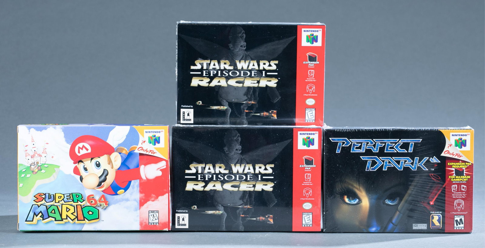 4 Nintendo 64 Sealed and CIB games.: A group of three Nintendo 64 Sealed and CIB games ++ Perfect Dark and two copies of Star Wars Episode 1 Racer. ++ Super Mario 64 complete in box.