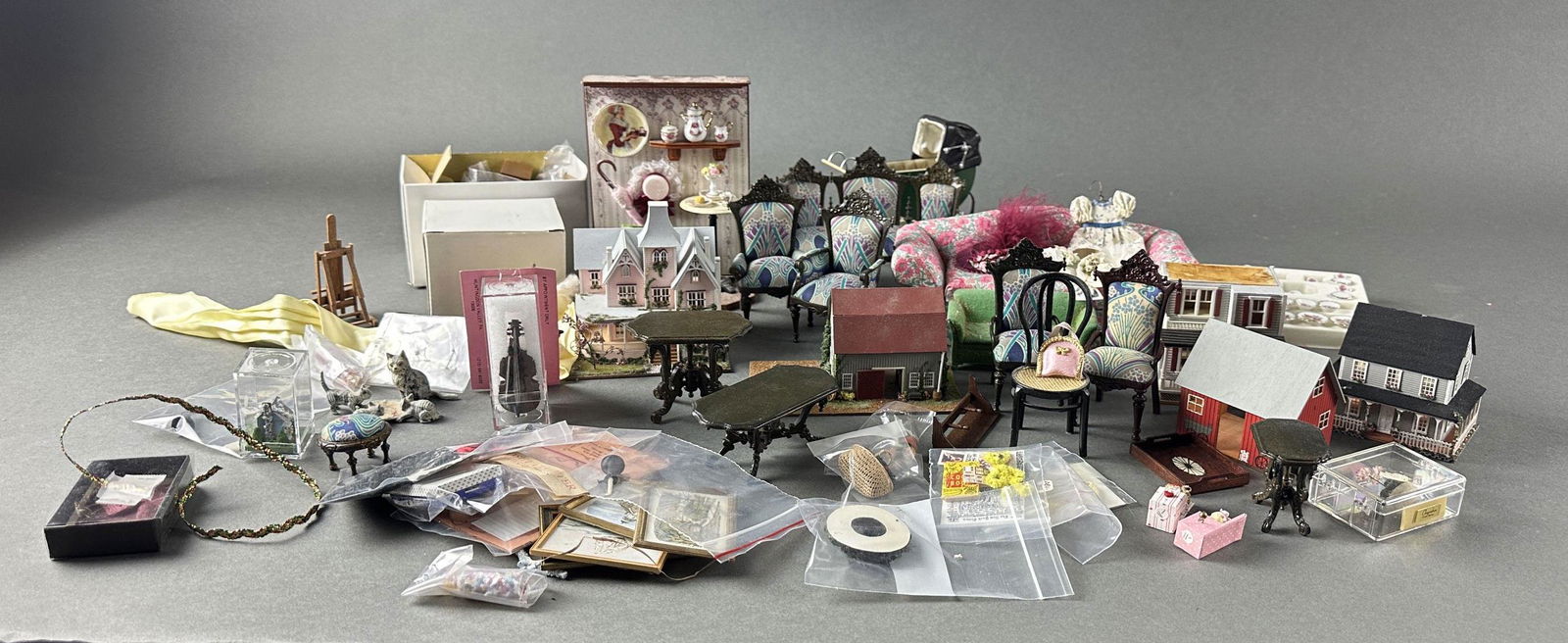Miniature houses and furniture: An assortment of small miniature houses and various furniture items. Includes a small Victorian house and a barn diorama as well as various pieces of miniature wooden furniture.
