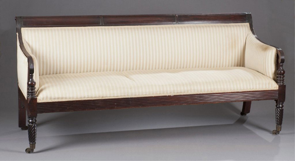 First half 19thC Mahogany Sheraton Sofa.: Sheraton mahogany upholstered sofa. First half 19th century. 34 1/2"h x 76"w x 24"d. Condition: Repair at left back foot. Chips and scratches throughout.