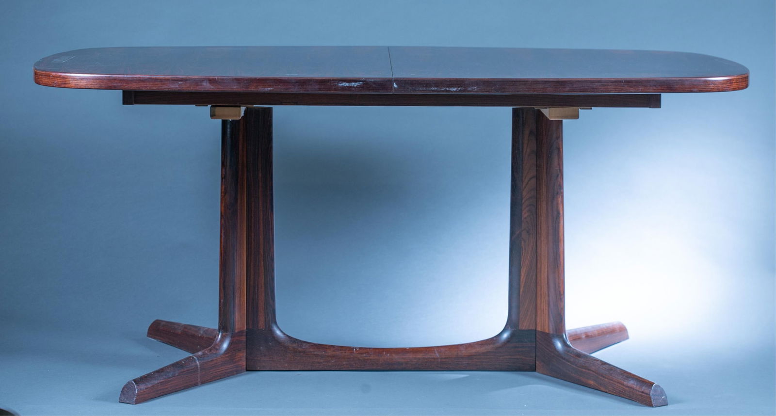Danish Modern Gudme rosewood table.: A Danish Modern Gudme Mobelfabrik rosewood table. Includes two leaves. 27" x 64" x 41"