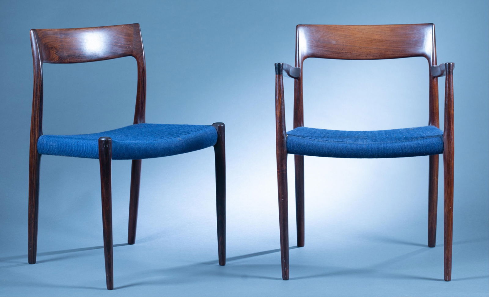 8 Danish Modern Niels Moller 77 side chairs.: A group of eight Danish Modern Niels Otto Moller for J.L. Moller Mobelfabrik Model 77 rosewood side chairs. Six side chairs and two arm chairs. Blue woven seats. Marked on underside. 30" x 22" x 17 3/