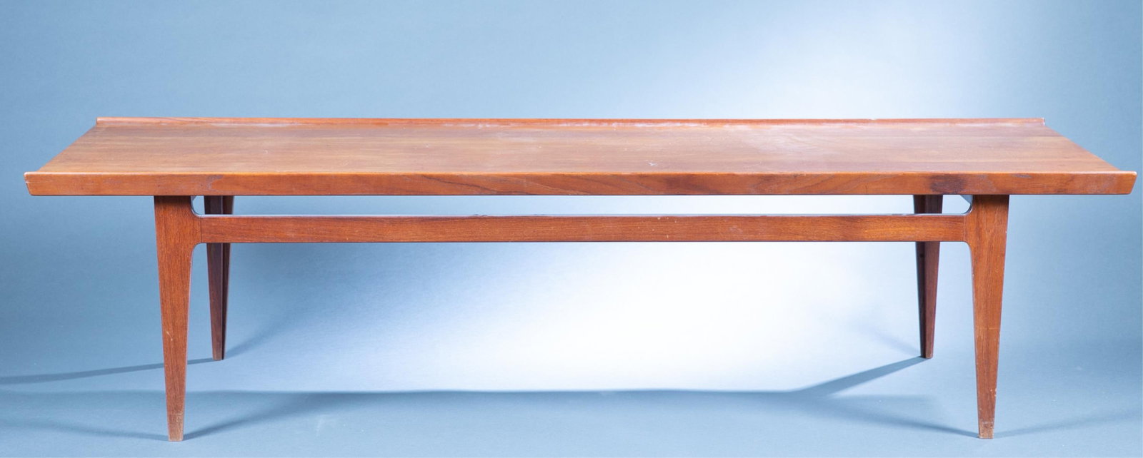 Danish Modern Finn Juhl coffee table.: A Danish Modern Finn Juhl (Danish, 1912-1989) for France and Sons teak coffee table. Marked on underside. 17 1/2" x 69 1/2" x 23 1/2".