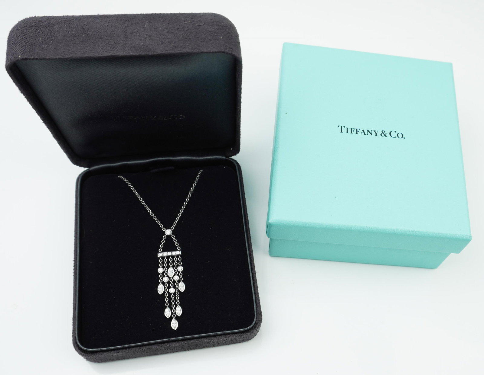 Tiffany & Co platinum and diamond bar drop pendant: A Tiffany & Co platinum and diamond bar drop pendant approx. 2.0" with platinum chain approx. 20", stamped TIFFANY & CO PT950 and tested platinum with diamonds approx. .97cttw. original price ticket o