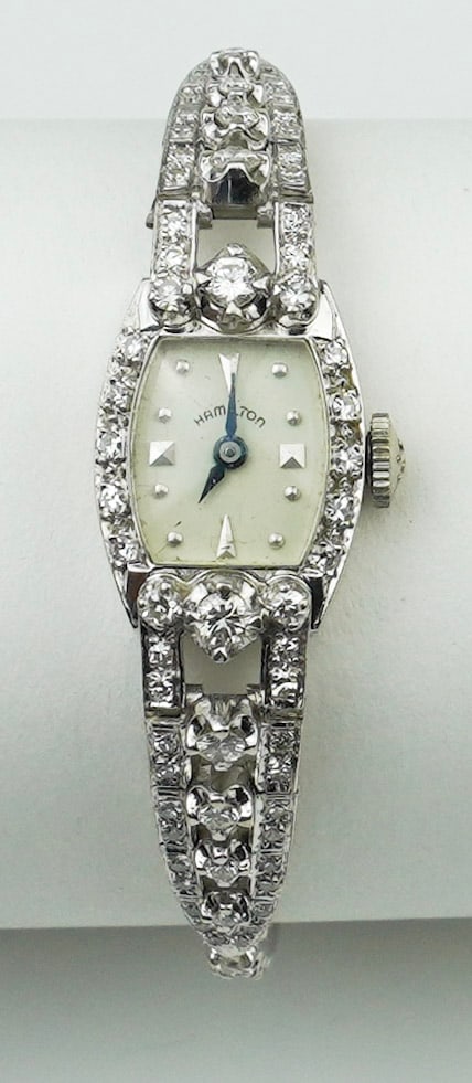 14KWG and diamond ladies Hamilton watch: A 14KWG and diamond ladies Hamilton watch approx. 6 1/4", manual wind 25 jewel movement in a 14K white gold case, 14K white gold band with approx. 70 mixed size round diamonds approx. 2.0cttw. , gross