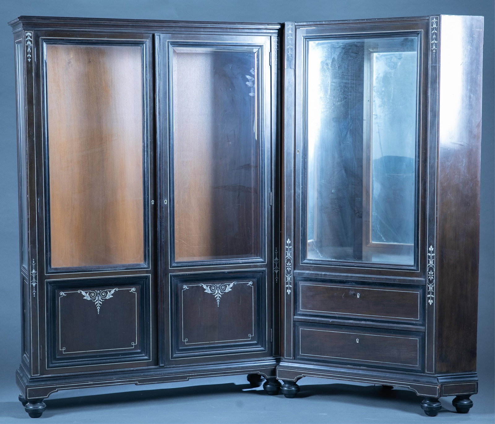 German inlaid cabinet.: A Max Bottcher, Dusseldorf inlaid two piece cabinet unit, circa 1900. Corner cabinet glass door over two drawers. Joining two glass door cabinet over two drawers. Hand written paper label on back of c