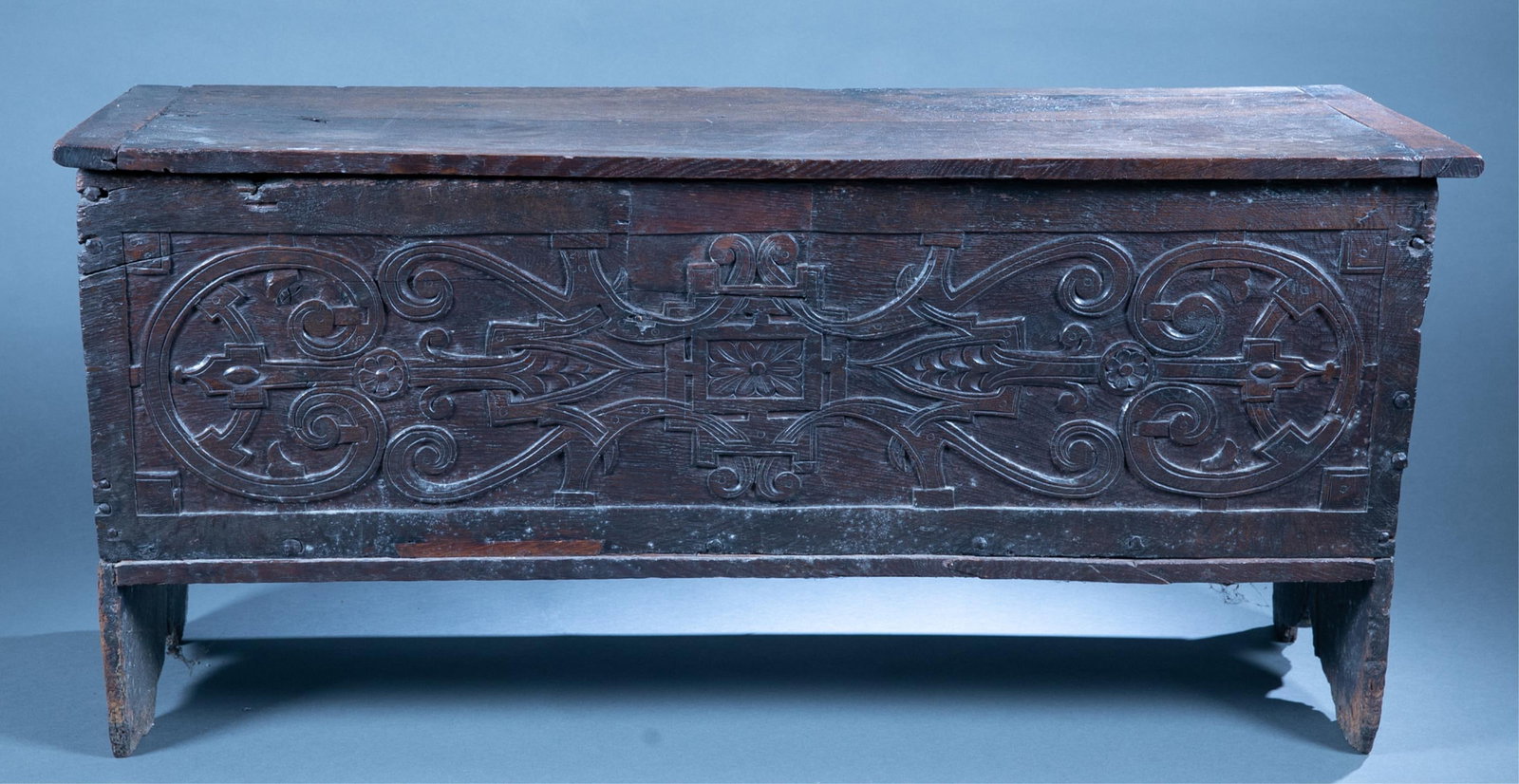 English oak coffer chest.: An English oak coffer chest, 17th Century. Carved geometric design on front. 23" x 50" x 16 1/2"Condition: Lock removed and filled. Bottom and hinges replaced.