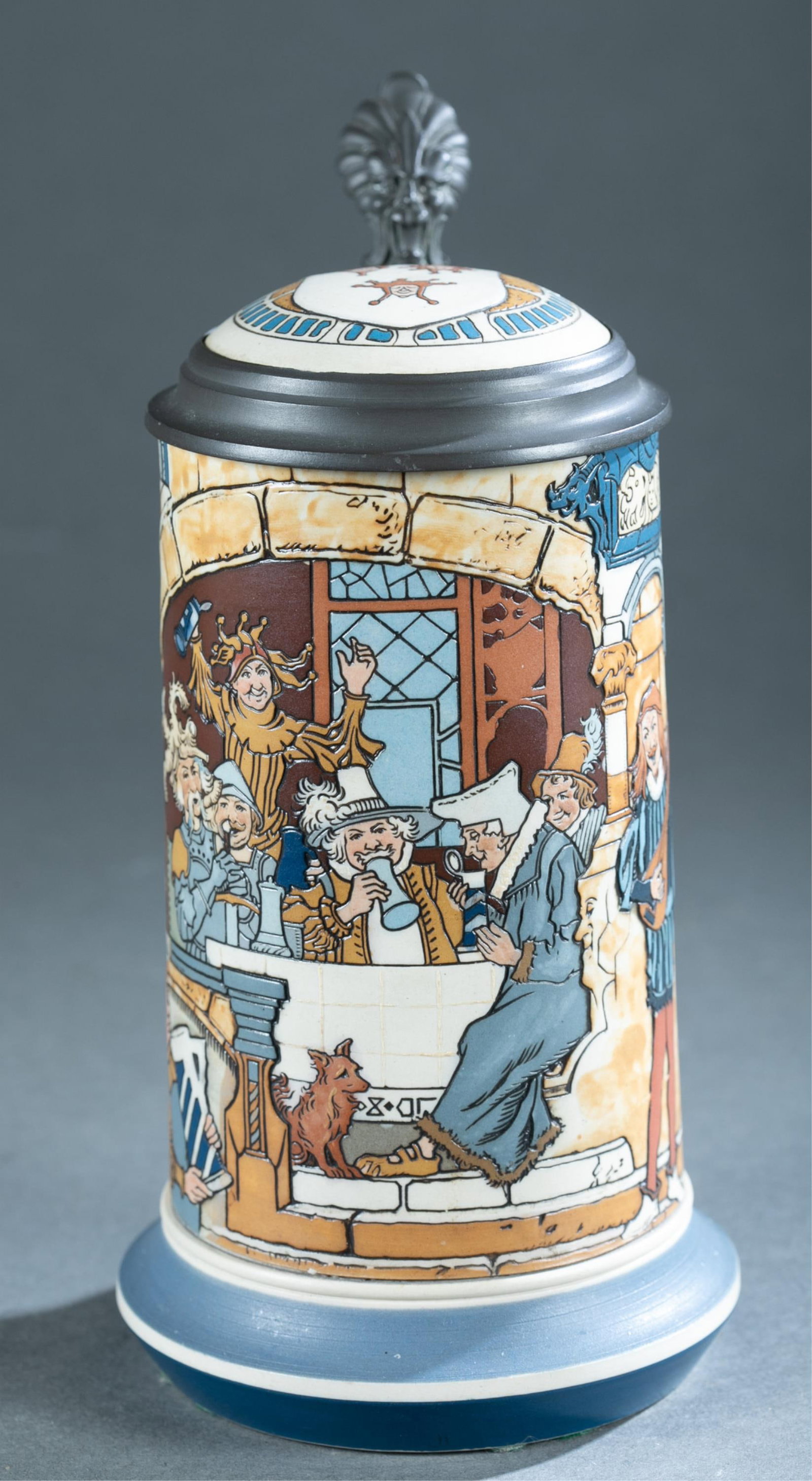 Mettlach H. Schlitt #2778 Carnival stein.: A Henry Schlitt (German, 1849-1923) for Mettlach 1/2 Liter “Group of Drinkers During Carnival” No. 2778 ceramic stein. Signed on side. Marked on bottom. Pewter mounts. 9" x 6" x 4 3/4"