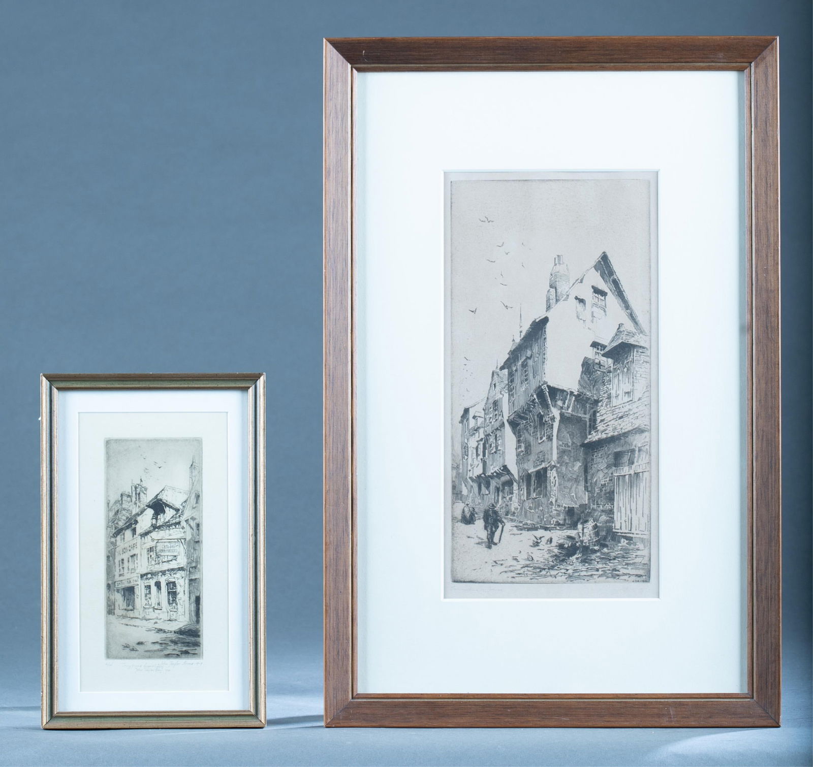 2 John Taylor Arms Etchings: Taylor Arms, John (American 1887 - 1954). ++ "Au Bon Cafe/L'Enseigne/The Sign". Etching. Signed, inscribed, dtaed, and editioned in pencil at lower margin. 6/14. Plate: 3" x 6 1/2". Frame: 6 3/4" x 10