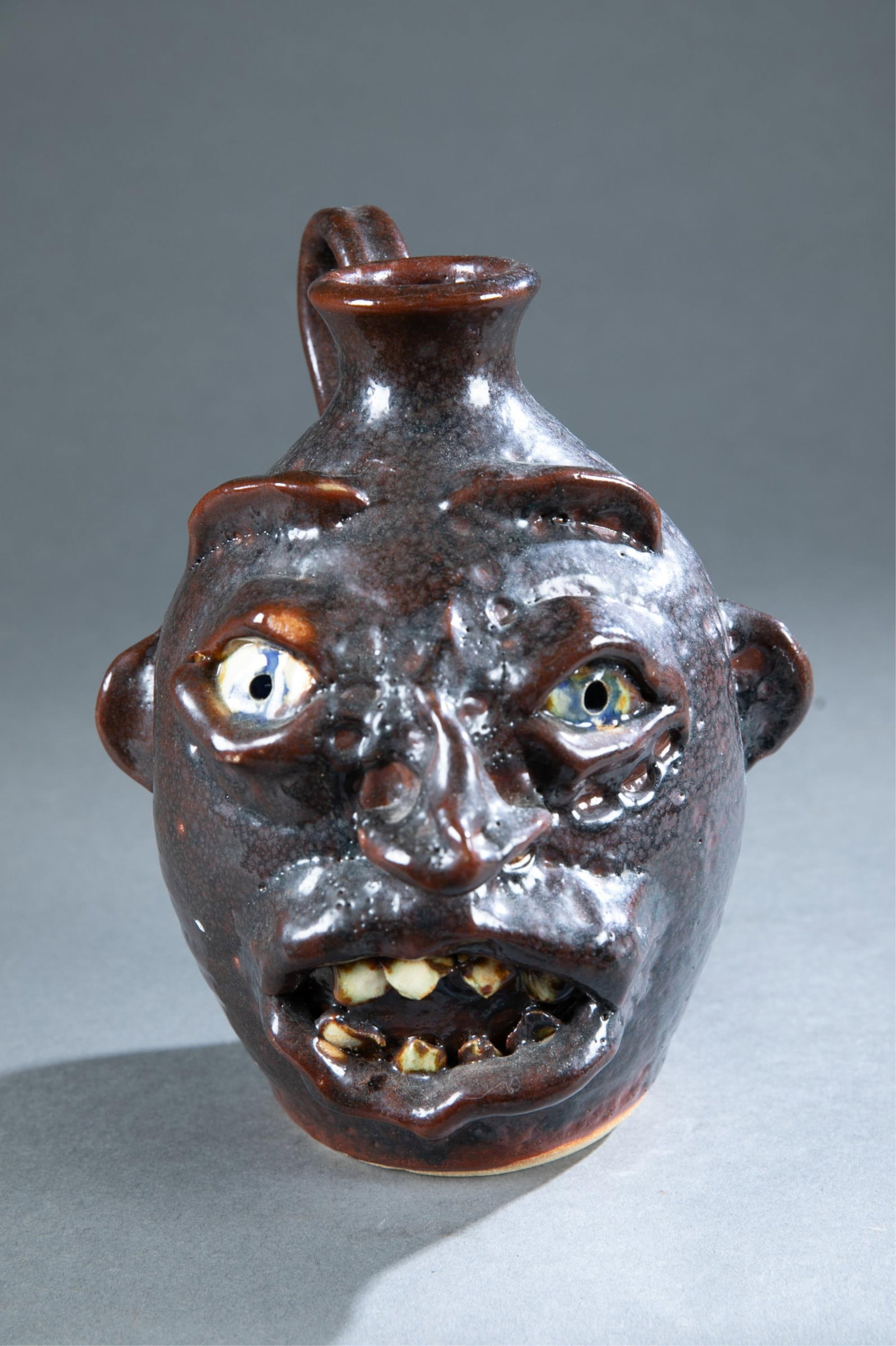 Kit Vanderwal, face jug: A Kit Vanderwal (American, 1943-2014) face jug. Lantern Hill Pottery, Seagrove, North Carolina. Marked on base. 9 1/4" x 7"