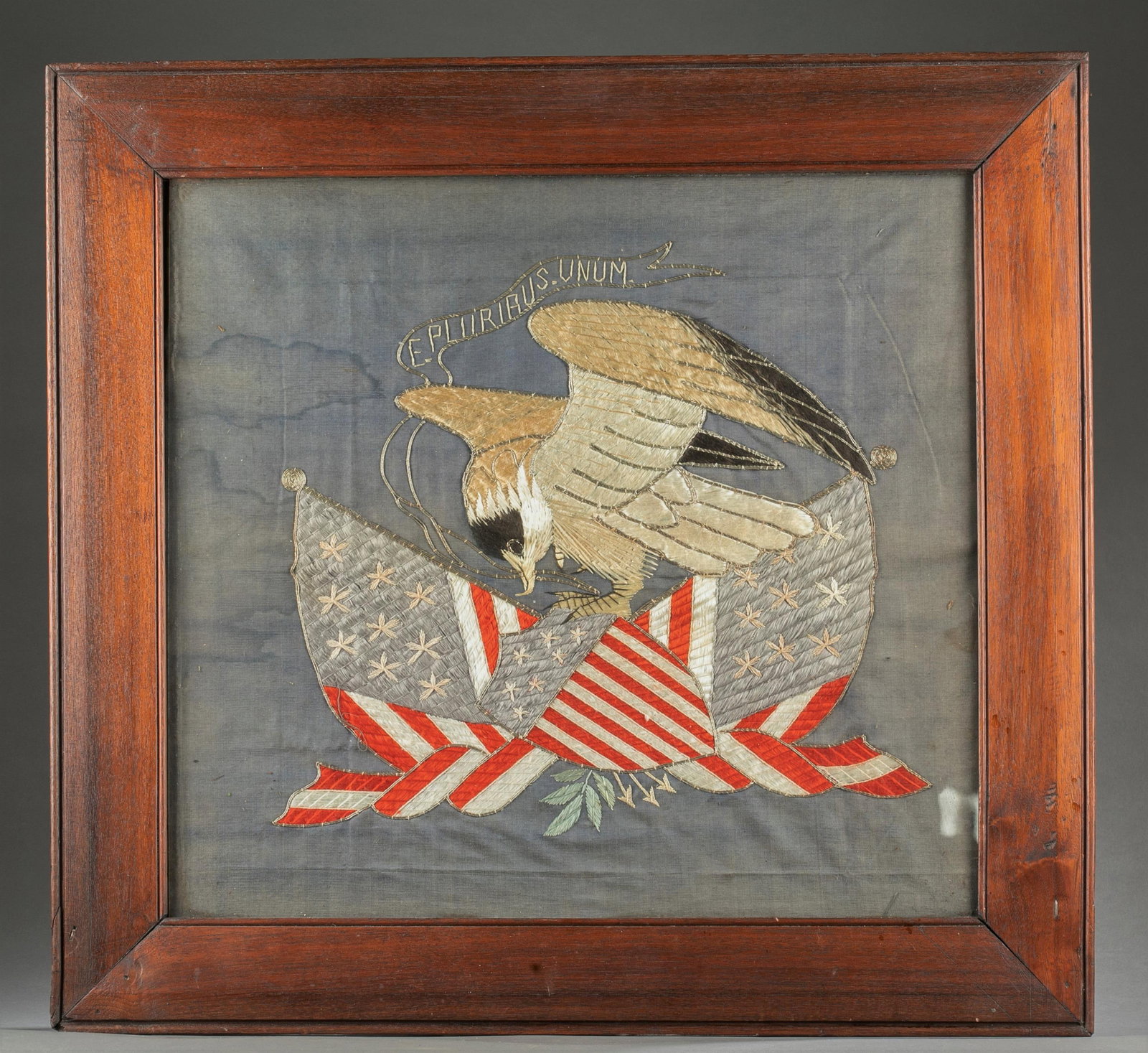 Patriotic Needlework eagle and flag, 1836.: A framed patriotic eagle and flag needlepoint made with silk and silver thread. The work is of an eagle and American flag and shield outlined in silver metallic thread mounted on blue linen cloth. Hel