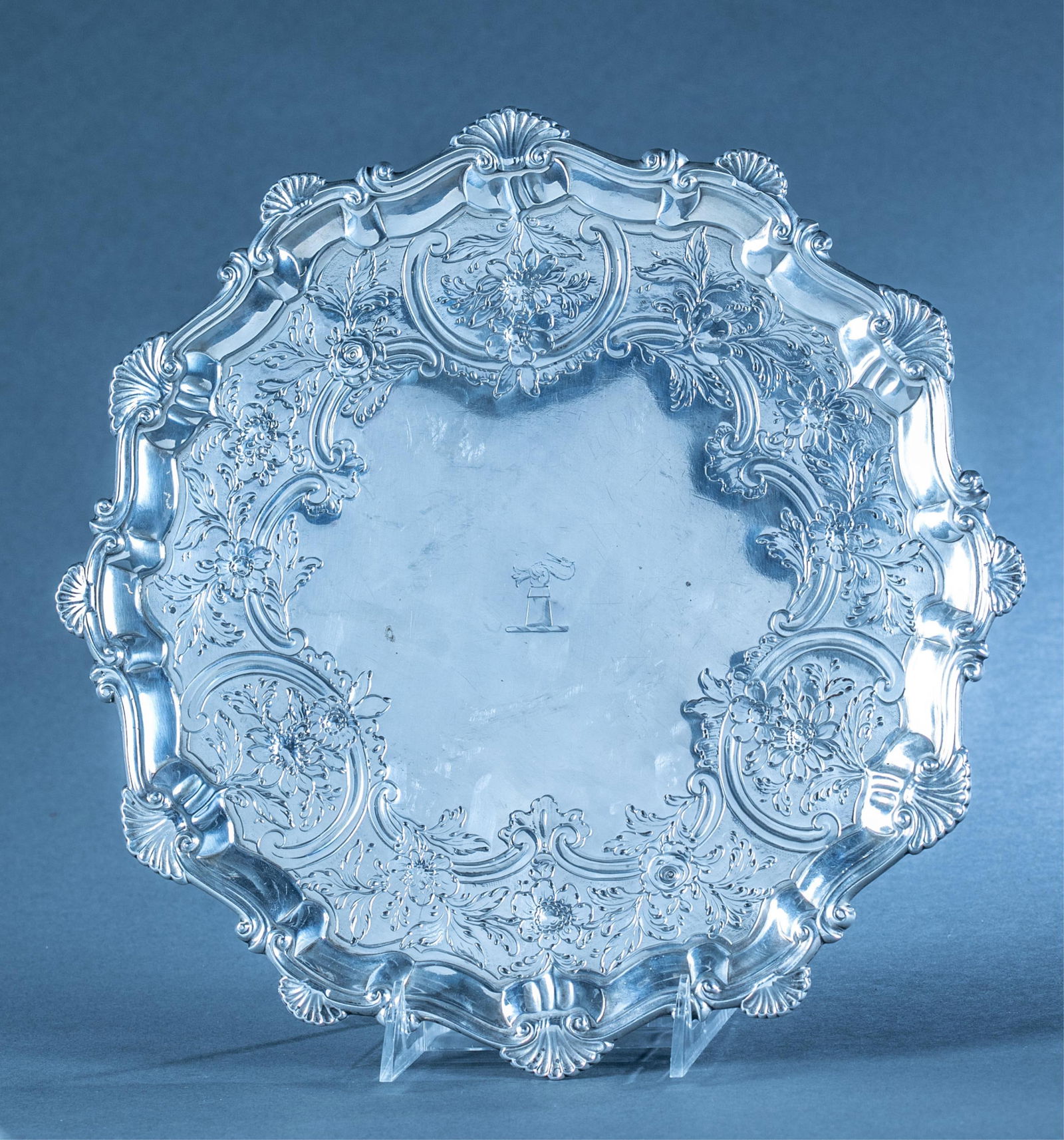 George III armorial sterling salver.: An English George III sterling silver salver. Shell decorated edge with central blazon of hand holding crane head of Michel family of Dorset. 1765 Ebenezer Coker or Elizabeth Cooke London hallmarks un