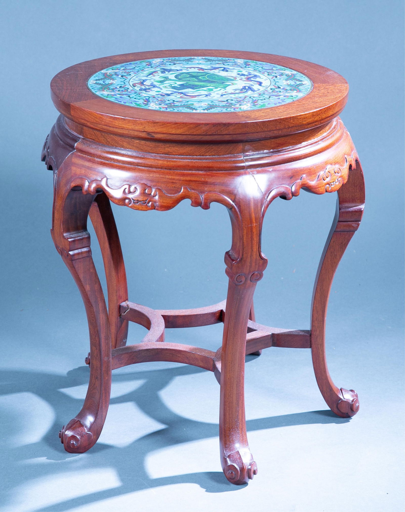 Chinese cloisonne topped plant stand.: A Chinese cloisonne topped plant stand. 20" x 10".