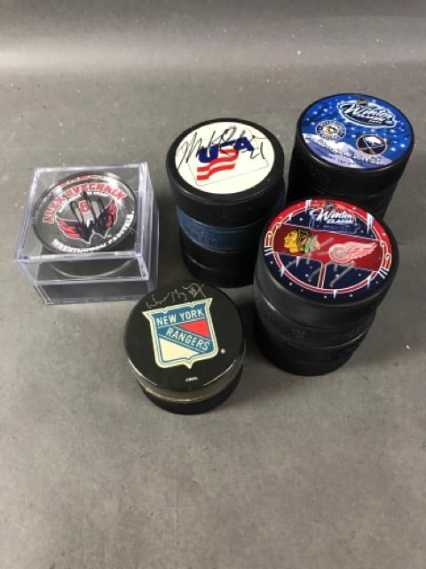 Autographed NHL Pucks: 16 pucks