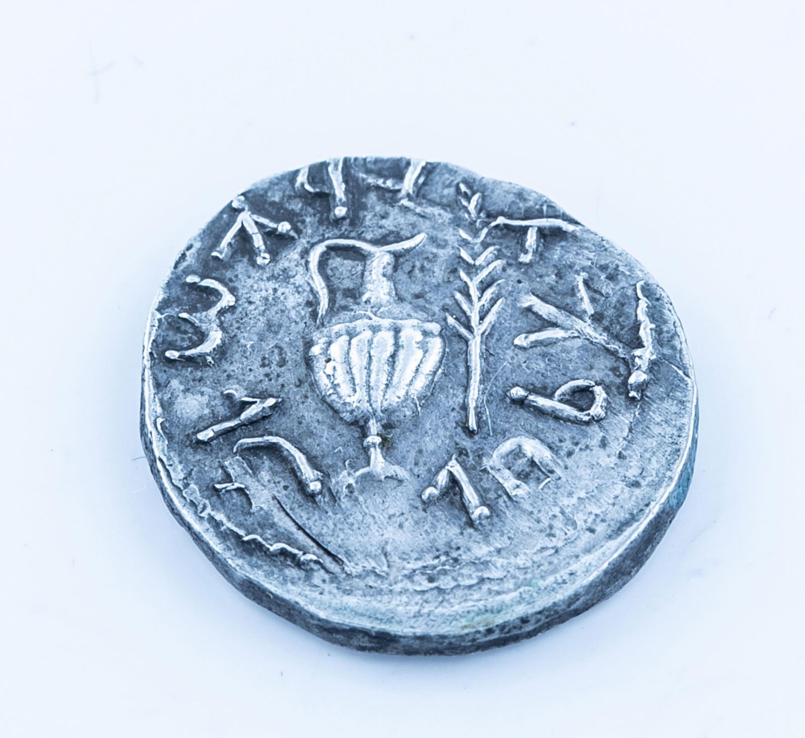 Judea, Bar Kokhba Revolt Year 3 AR Zuz XF: A Judea, Bar Kokhba Revolt (132-135 CE) silver Zuz. Attributed to Year 3 (134/5 CE). Obverse: "Simon" (Paleo-Hebrew) surrounded by wreath with eight almonds. Reverse: "For The Freedom of Jerusalem" (P