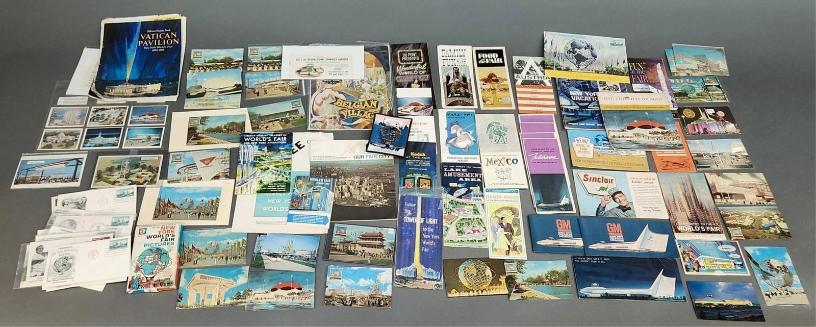 1964 New York World's Fair ephemera: A large collection of 1964 New York World's Fair ephemera. Including postcards, first day issue stamps, pamphlets, booklets, and brochures.