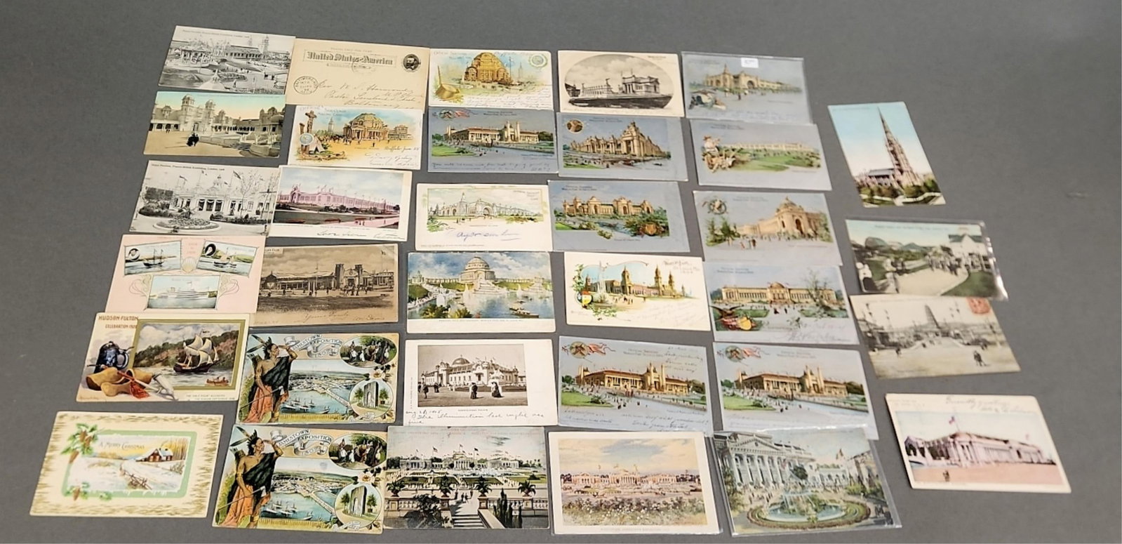 World's Fair ephemera: A group of World's Fair ephemera from the late 19th to the early 20th century. Including postcards and first day of issue stamps from 1893, 1901, 1904, 1905, 1907, 1908, 1909, 1913,