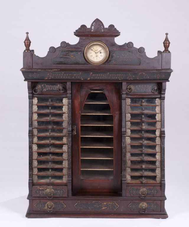 Victorian Renaissance Revival Spool Cabinet.: A Brainerd Armstrong & Co. Renaissance Revival partial gilt ebonized walnut spool cabinet. Last quarter 19th century. With key wind clock. 34"h x 45 3/4"w x 20"d.