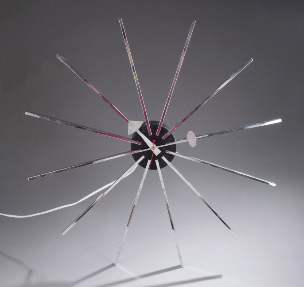 Nelson & Associates / Howard Miller Wall Clock.: Howard Miller Zeeland, Michigan. George Nelson for chrome wall clock. c.1954. Model number 2227. 23 1/4"w x 2 5/8"d.