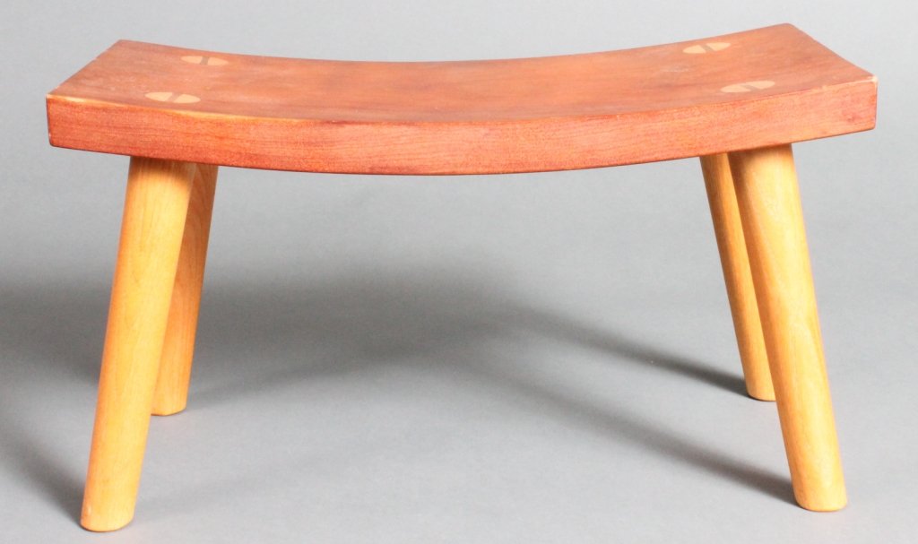 Thomas Moser crescent stool.: Thomas Moser cherry wood crescent stool. c.1999. Signed, "Thos. Moser Cabinetmakers Auburn, Maine, 1999, Barabara Foster." 8 1/2"h x 15"w x 7 1/2"d.