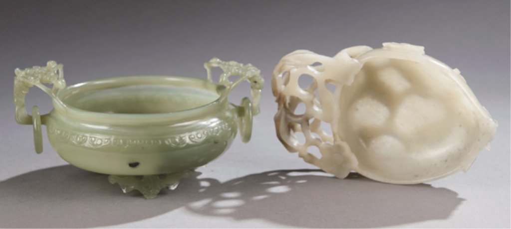 Group of two Chinese carved stone brush washers.: Group of two Chinese hard stone (pos. celadon jade) brush washers with carved floral motifs One carved peach design surrounded by floral motif, 1 1/2"h x 5 1/4"l x 1 1/4"w. Second bowl with tripod fee