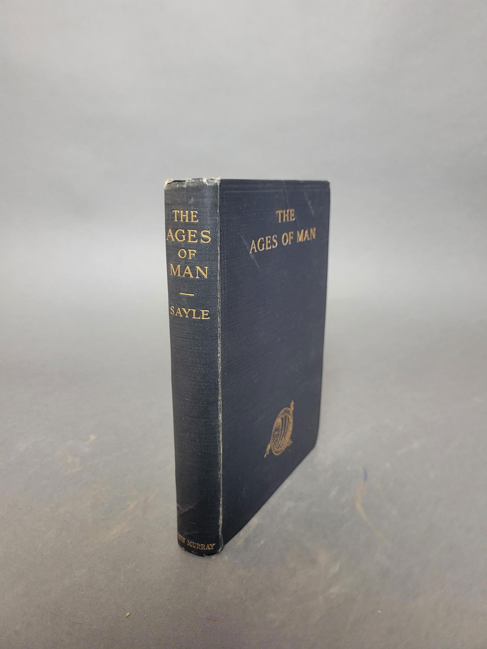 The Ages of Man. Signed by William Osler: [Science] Sayle, Charles. The Ages of Man. John Murray, London, 1916. 8vo. (12) 175 (1) pp., blue green cloth, gilt titles on cover and spine with gilt design bottom of upper board. Signed and dated b
