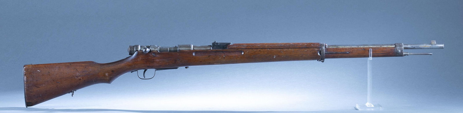 Japanese Arisaka Type 38 blank firing trainer: A Japanese Arisaka Type 38 blank firing smoothbore trainer, 6.5 Jap. 28" barrel. Wood stock. Serial 3500. No manufacturer mark. 44 1/2" overall. Condition: Fair condition. Patina on metal. Mechanicall